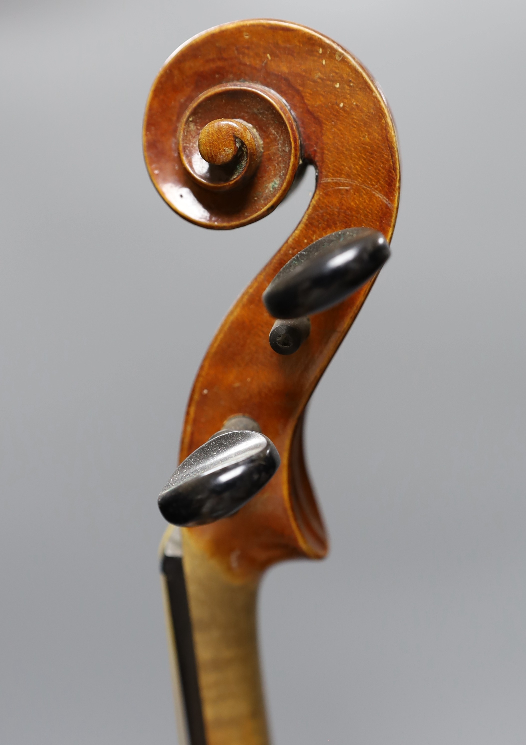 No labe and it is a full sized one.An early 20th century cased violin, length of back 36 cm